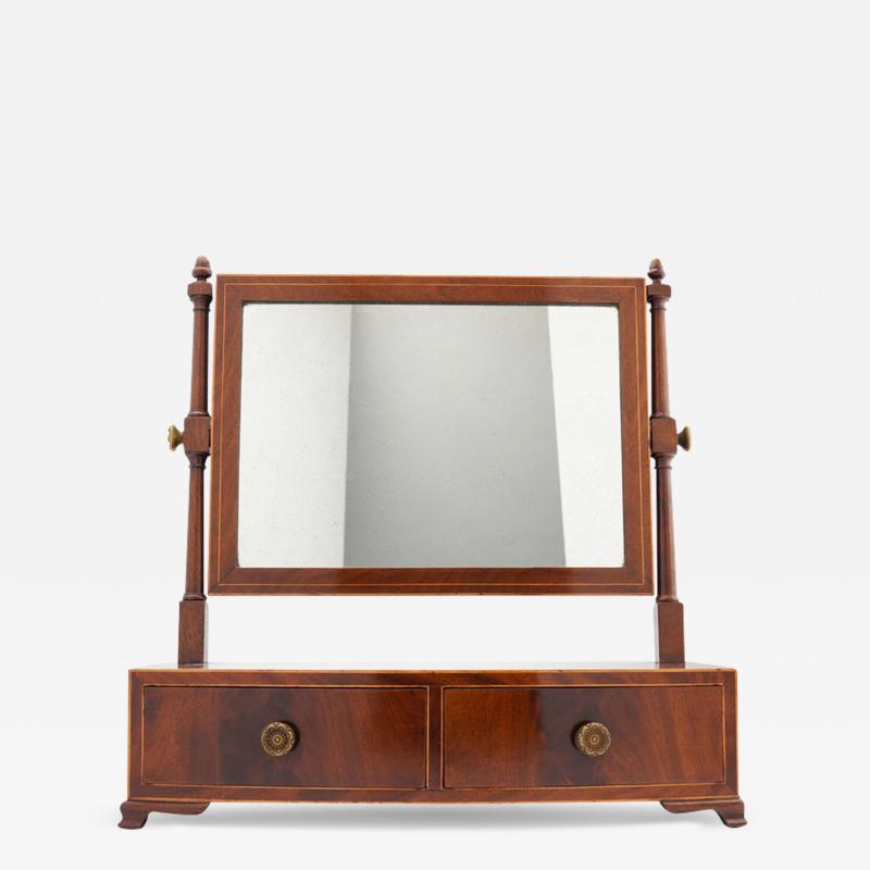 Rectangular mahogany swinger dressing mirror on a bow front stand with drawer