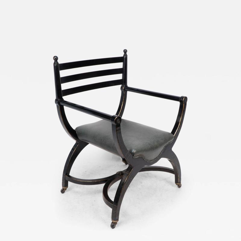 Richard Charles Richard Charles Aesthetic Movement Ebonised Elbow Chair with X Frame Stretcher