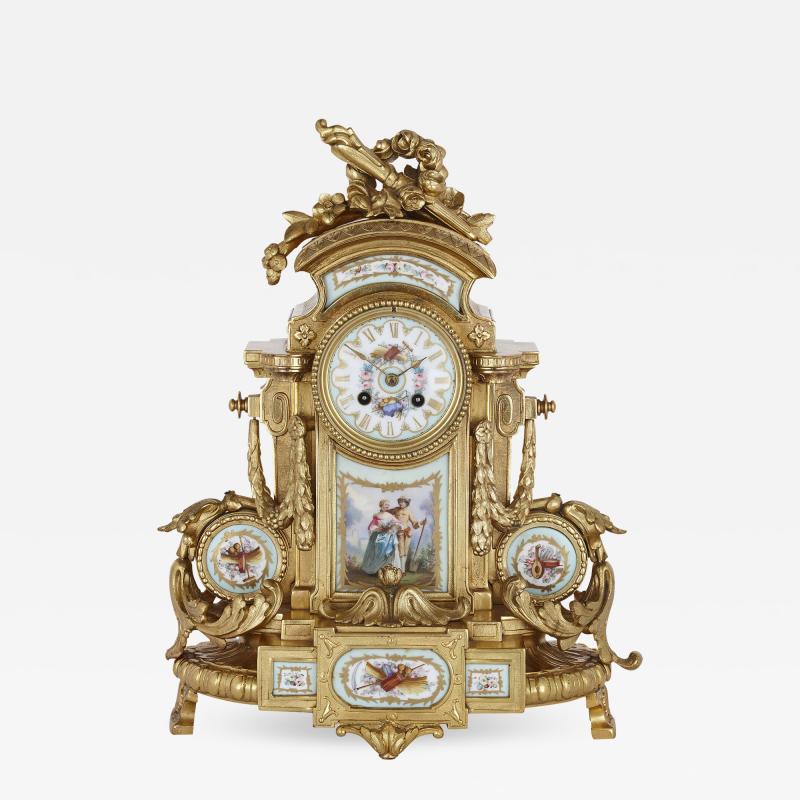 Rococo style gilt bronze mantel clock with S vres style porcelain plaques