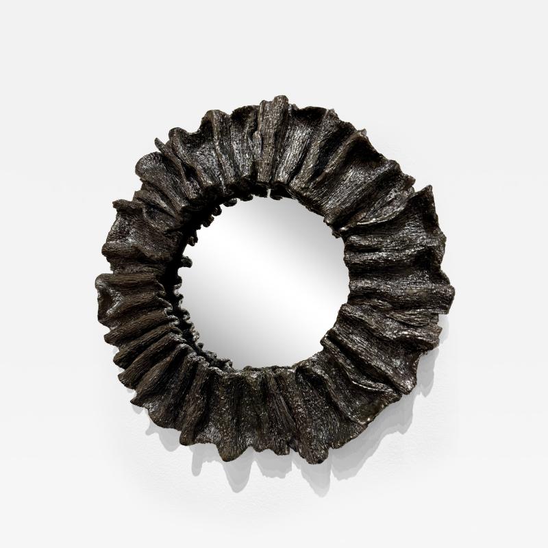 Ruffled and textured decorative mirror in a black iron glaze Made By Aram C 
