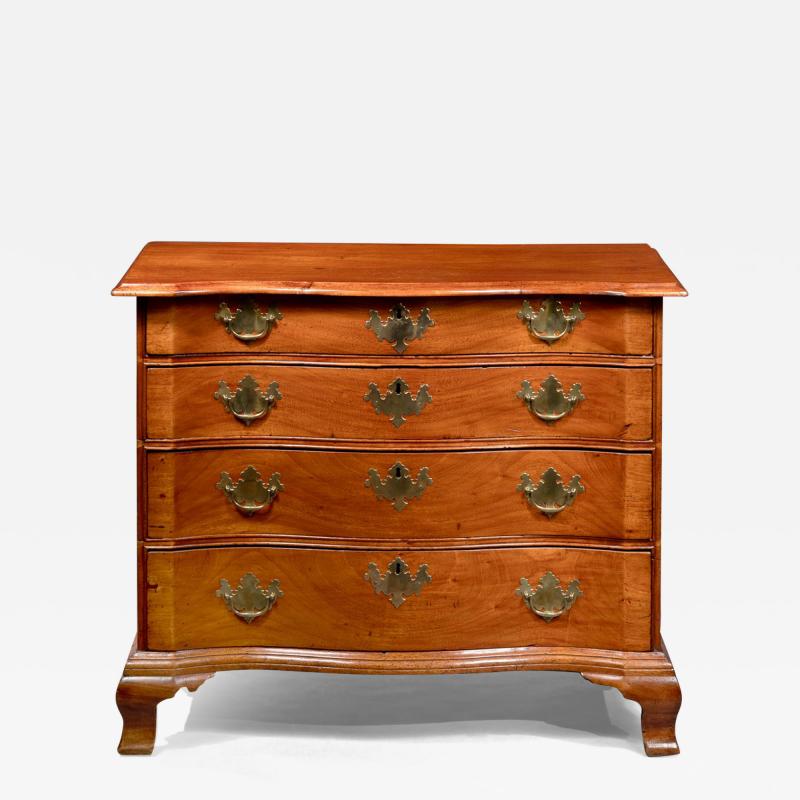 SERPENTINE CHEST WITH OGEE FEET AND BLOCKED ENDS