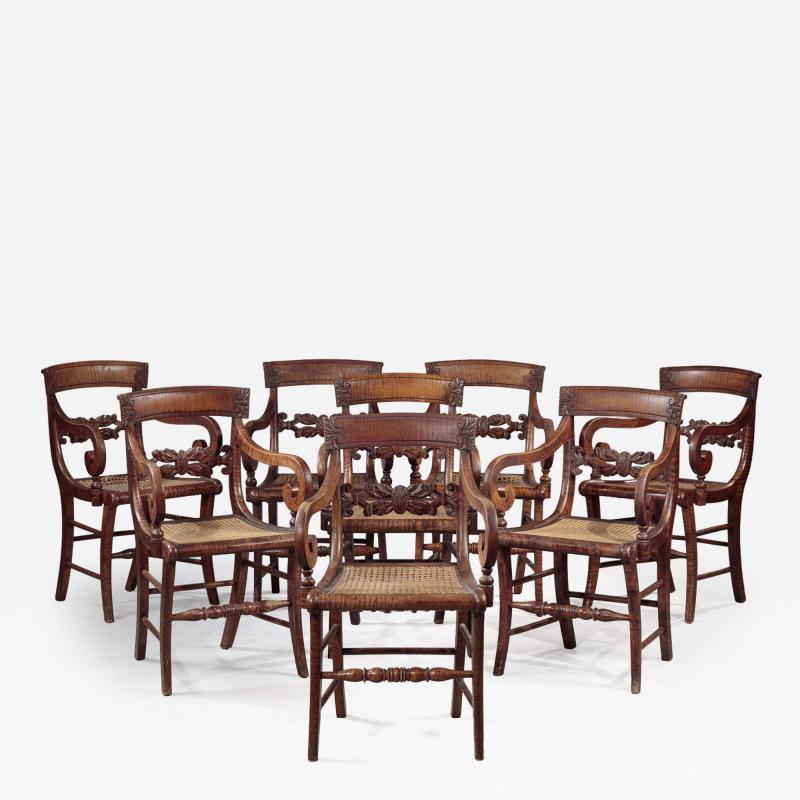 SET OF EIGHT FIGURED MAPLE ARMCHAIRS