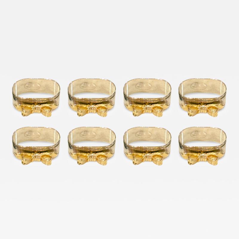 SET OF EIGHT SIVERPLATE GOLDTONE BOW DESIGN NAPKIN RINGS