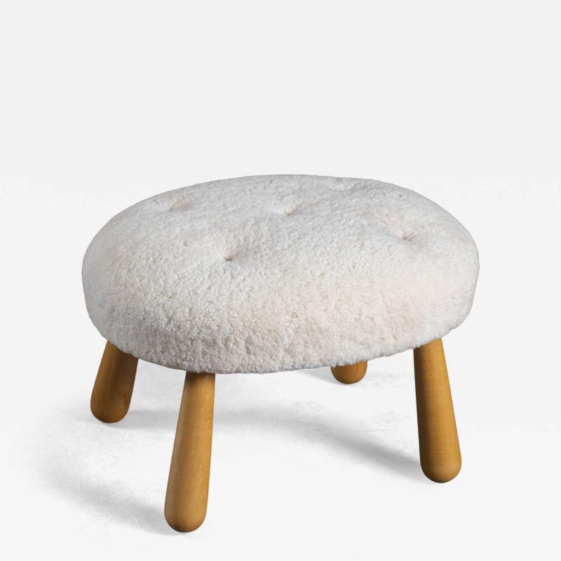 SHEEPSKIN UPHOLSTERED OTTOMAN