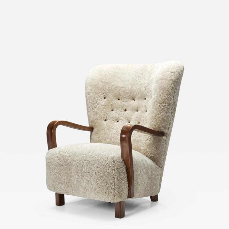 Scandinavian Mahogany Armchair in Sheepskin Scandinavia ca 1950s
