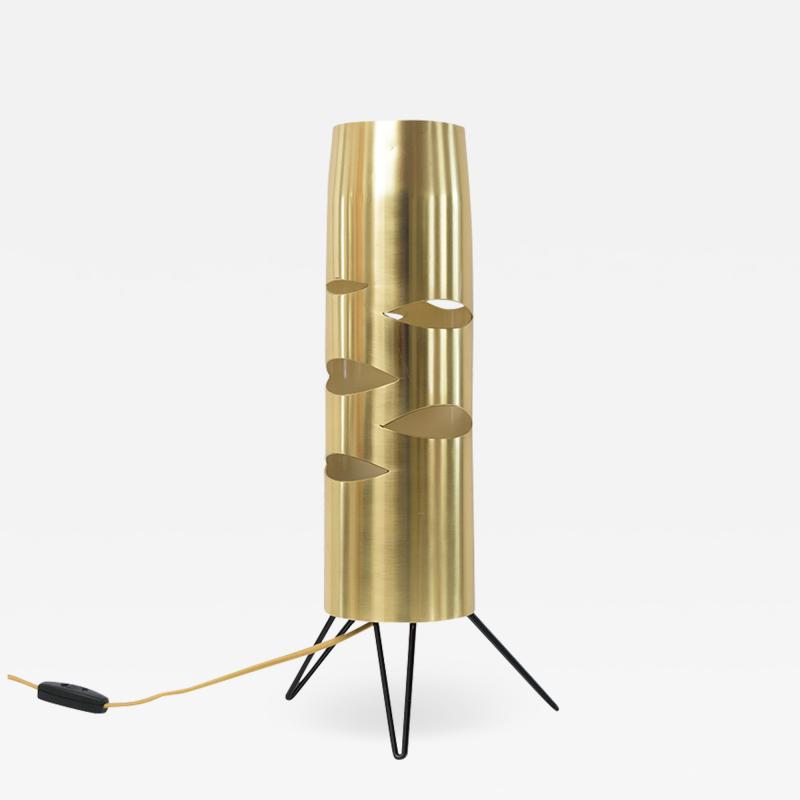 Scandinavian Modern cylindrical brass lamp with cutouts on a tripod base 