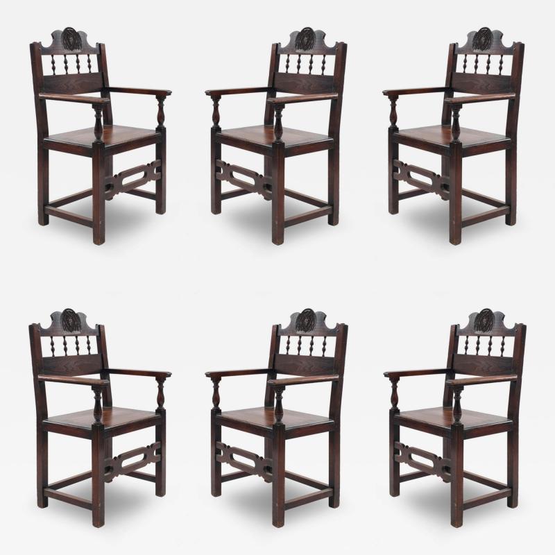 Set of 7 English Renaissance Spindle and Crest Walnut Armchairs
