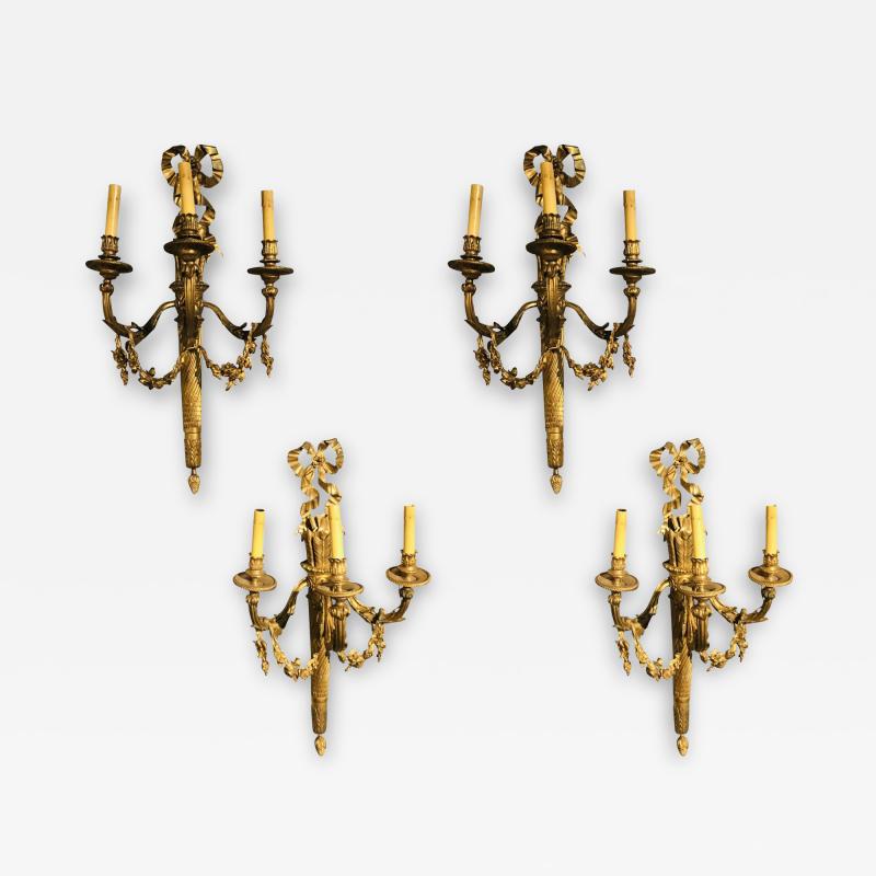 Set of Four Large Ornate Three Light Torch and Ribbon Form Wall Sconces
