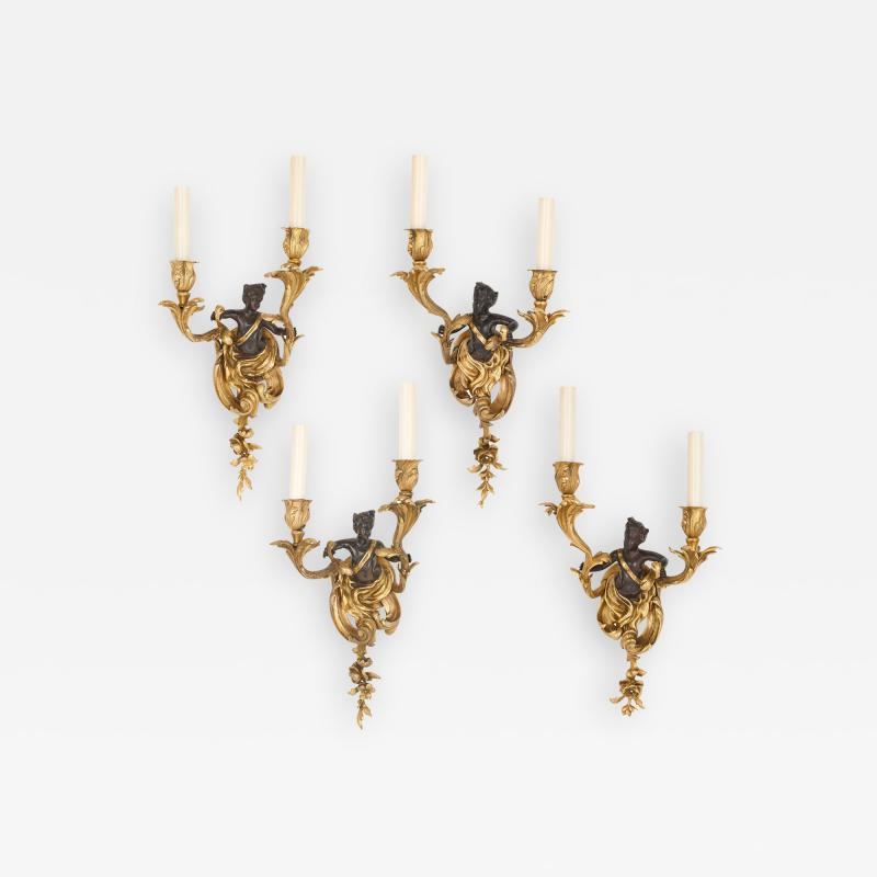 Set of four Rococo style patinated and gilt bronze sconces