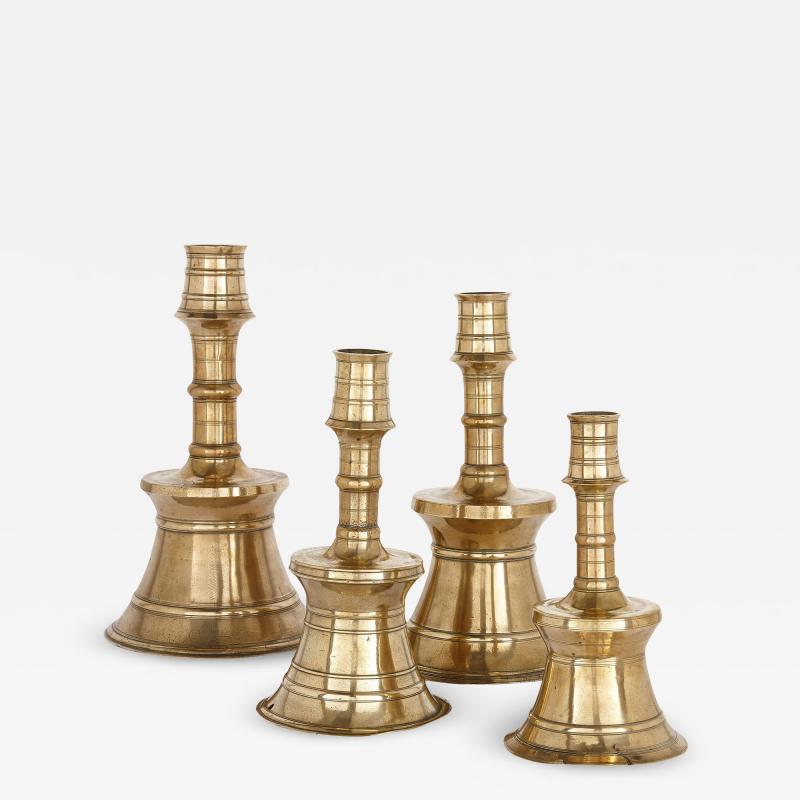 Set of four cast and turned brass Ottoman candlesticks