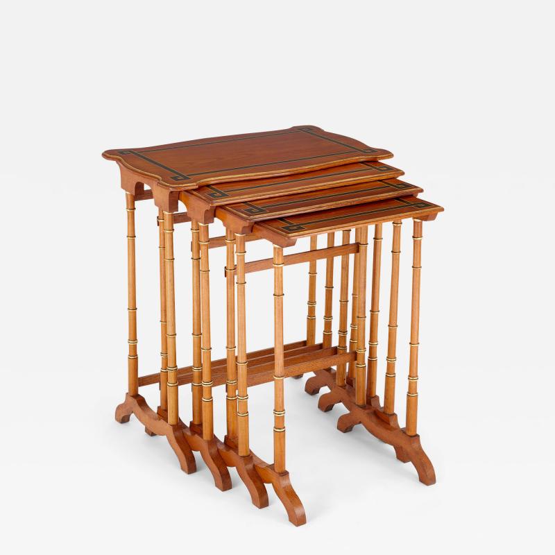Set of four nesting side tables with ebonised wooden inlay