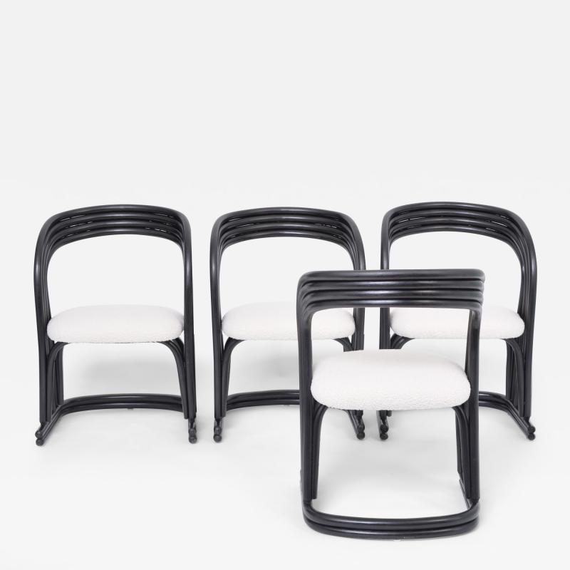 Set of four reupholstered dining chairs in organically formed black rattan