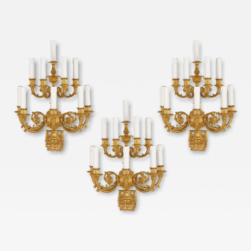 Set of three Neoclassical gilt bronze wall lights
