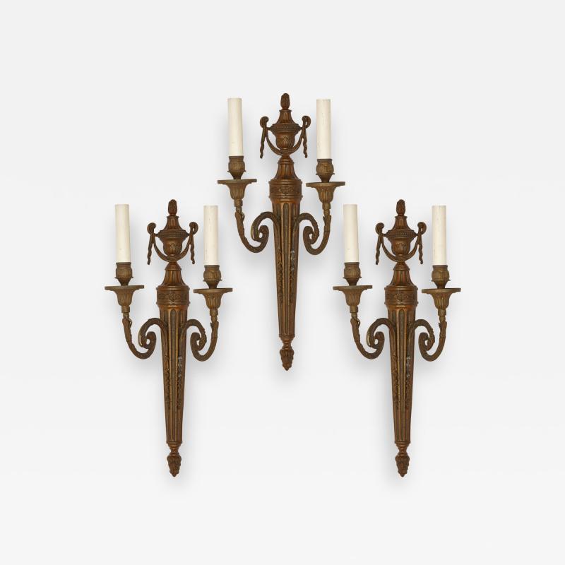 Set of three metal sconces in the Neoclassical style