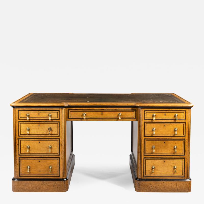 Small Victorian oak and ebony partner s desk attributed to Holland and Son