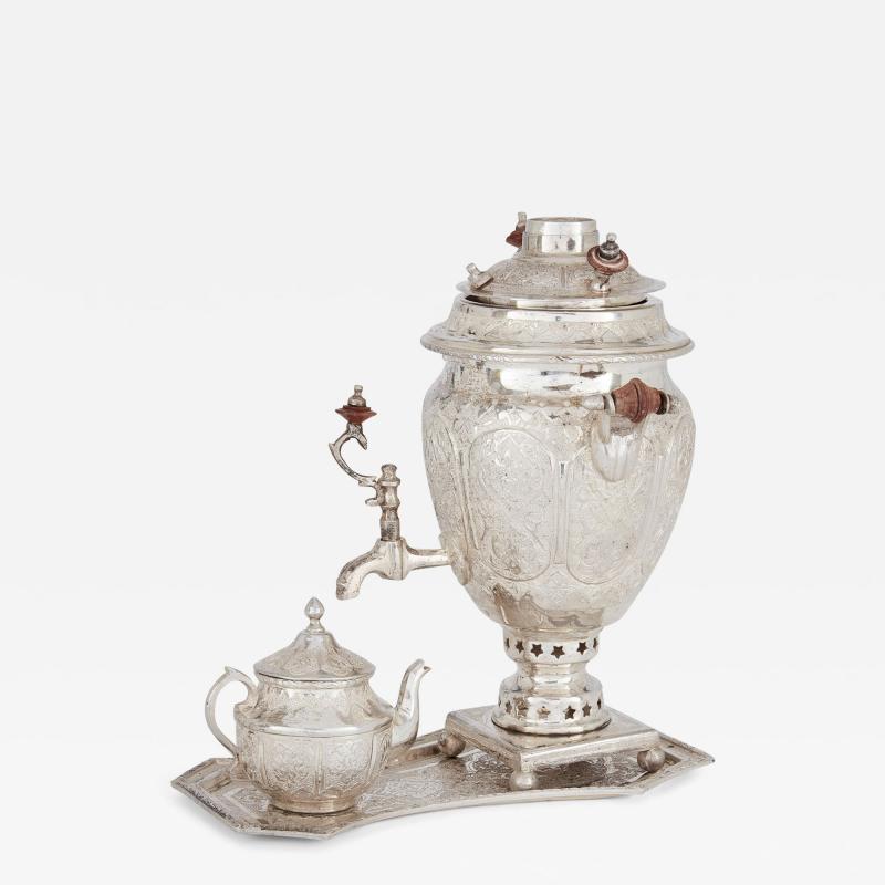 Small engraved silver part tea service of Persian design