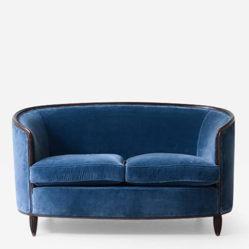 Splendid two seater curved sofa with velvet upholstery 