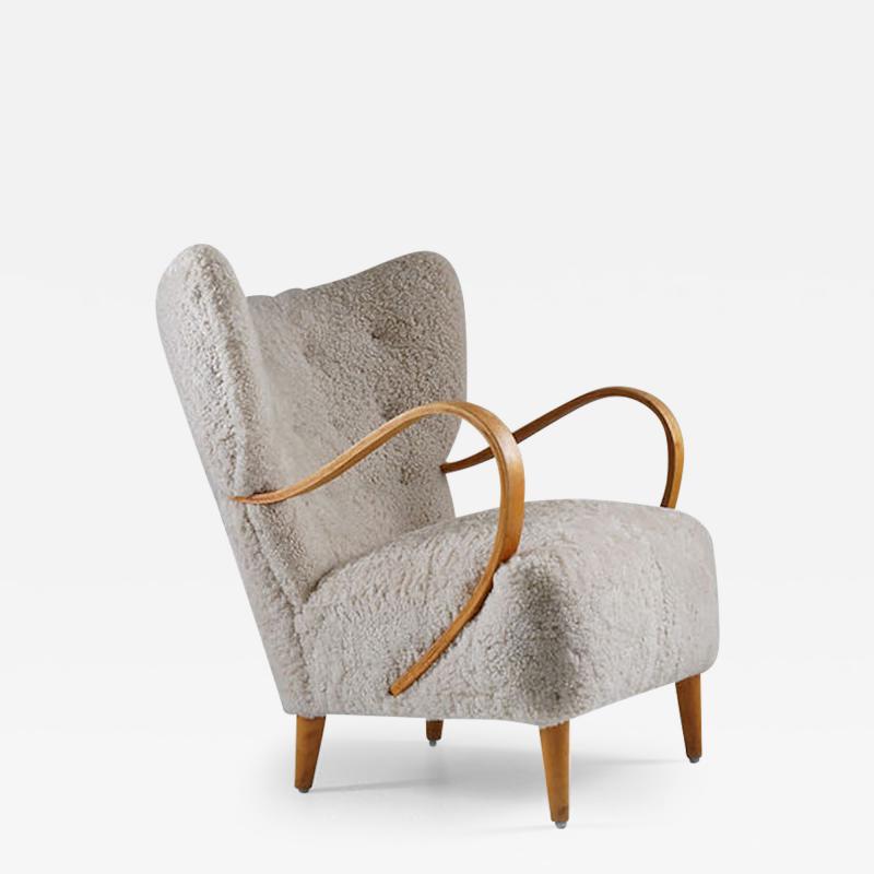 Swedish Midcentury Wingback Lounge Chair in Sheepskin