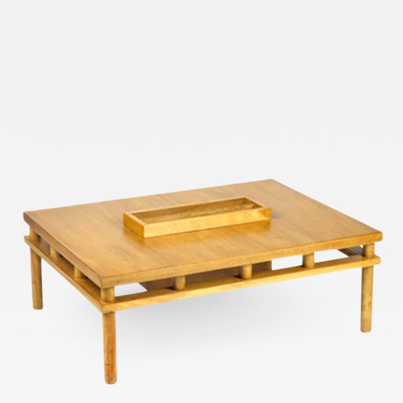 T H Robsjohn Gibbings T H ROBSJOHN GIBBINGS COCKTAIL TABLE WITH CENTER MAGAZINE HOLDER