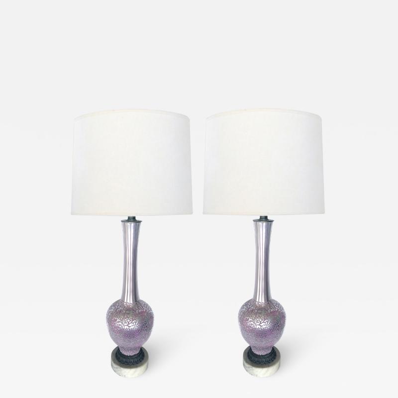Tall pair of reverse silvered lamps with applied floral vine decoration