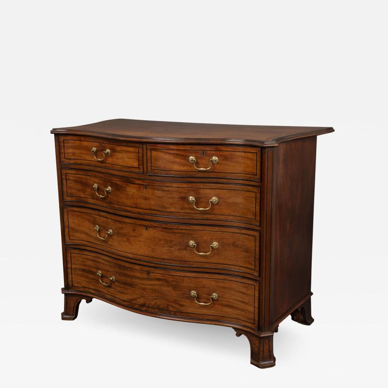 Thomas Chippendale A George III Serpentine Fronted Chest of Drawers in the Manner of Chippendale