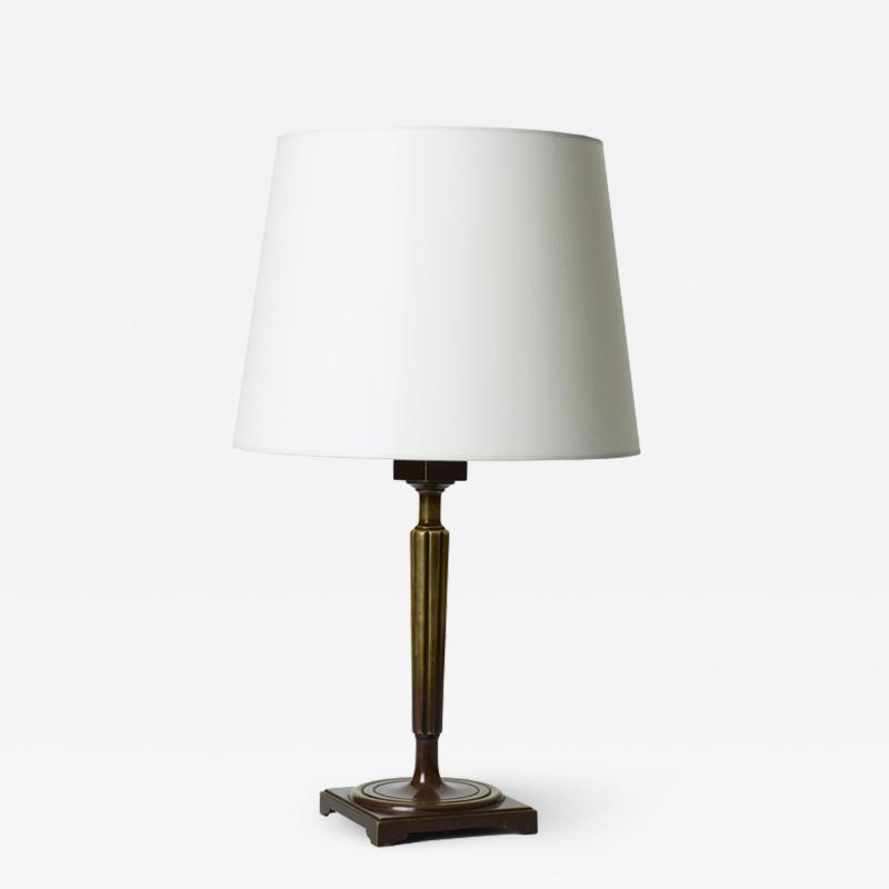 Thorvald Bindesb ll Table lamp with abstracted torch theme in bronze by Thorvald Bindesb ll