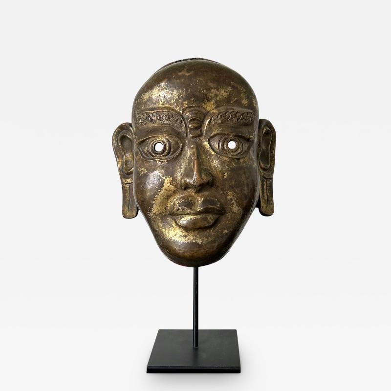 Tibetan Gilt Copper Alloy Mask on Display Stand