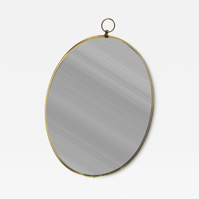 Tommi Parzinger MID CENTURY BRASS FRAMED OVAL MIRROR WITH RING IN THE MANNER OF TOMMI PARZINGER