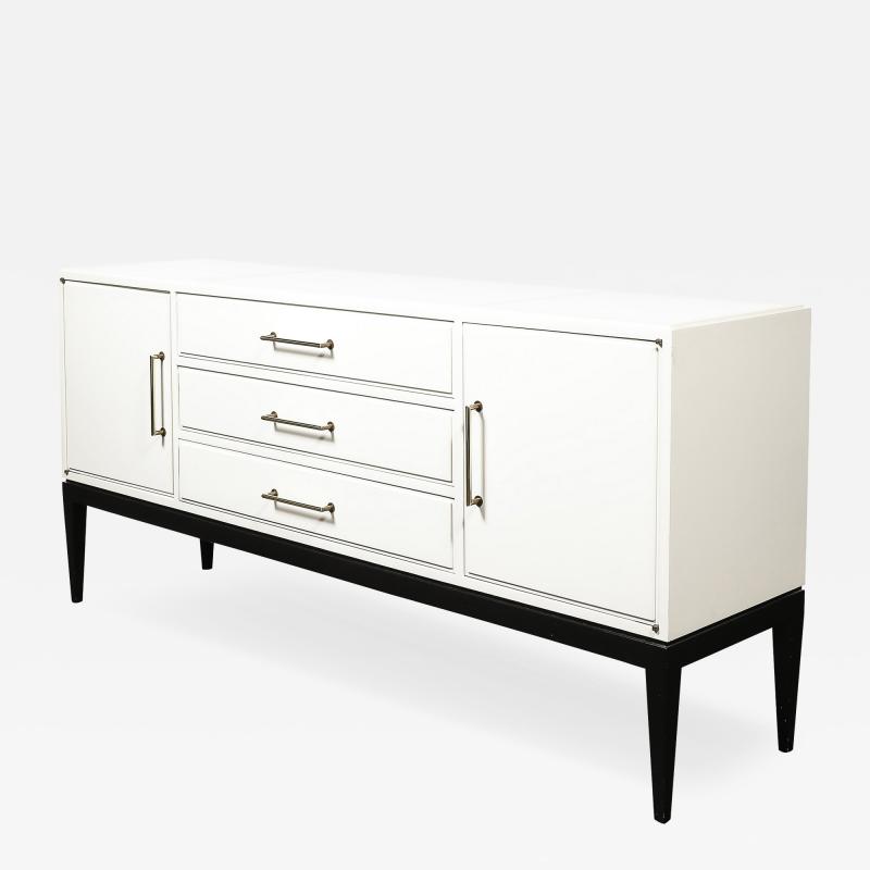 Tommi Parzinger Mid Century Cream Lacquer w Black Lacquer Supports Sideboard by Tommi Parzinger