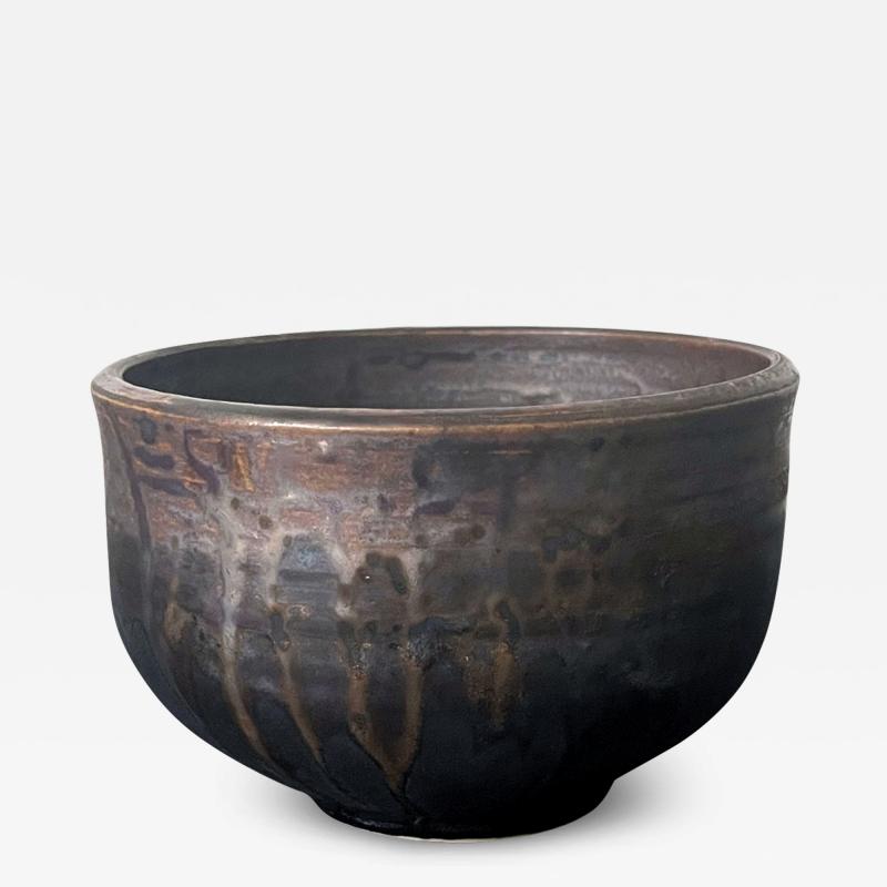 Toshiko Takaezu Ceramic Tea Bowl with Black Iridescent Glaze by Toshiko Takaezu