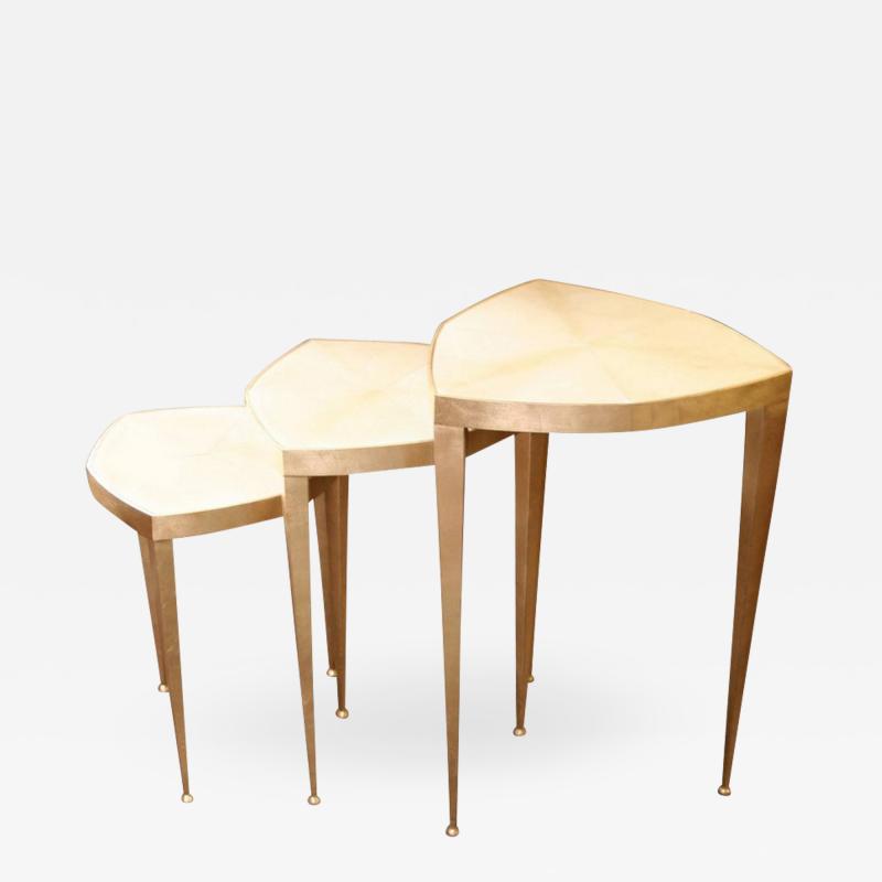 Trifolium set of three pedestal tables in gold leaf on steel and parchment