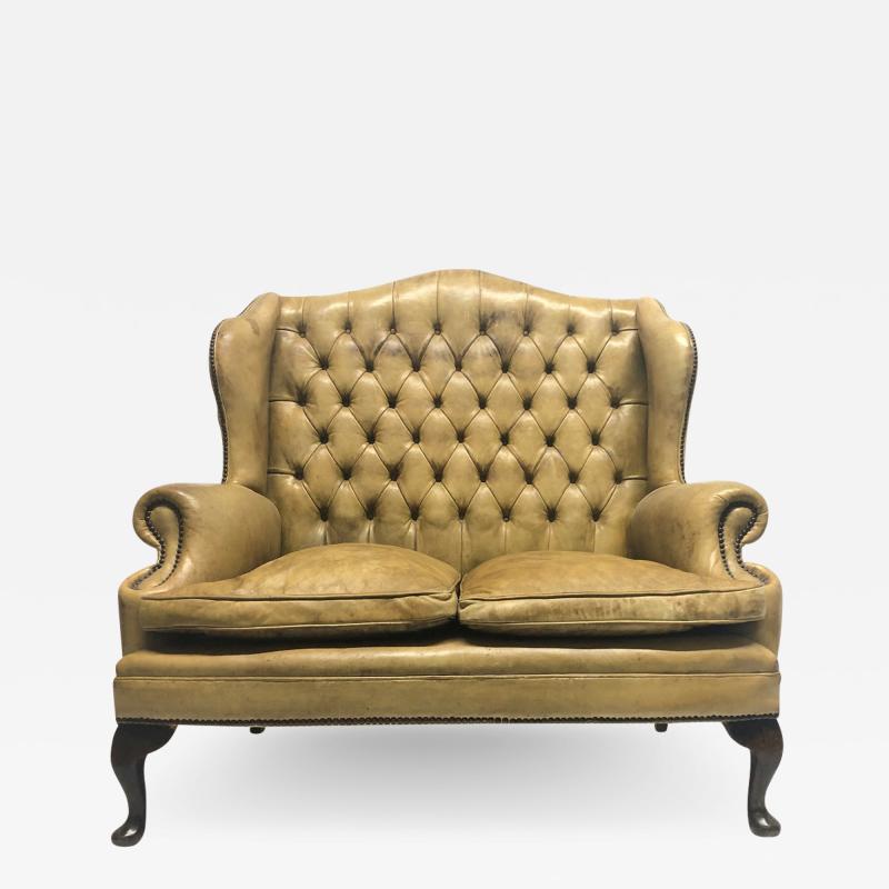 Tufted Leather Wingback Loveseat in the Style of Chippendale