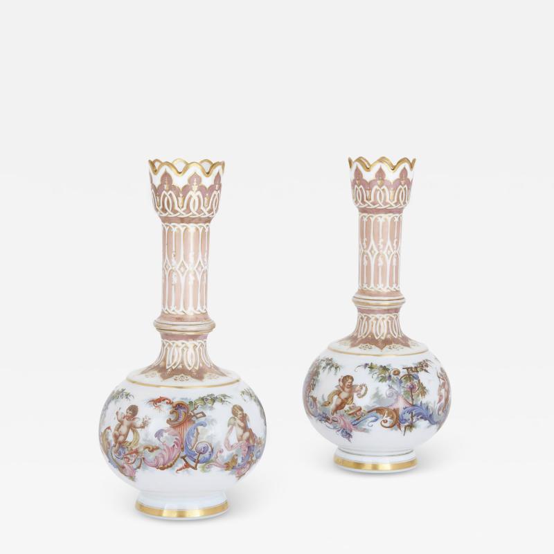 Two Bohemian opaline glass vases with painted cherub scenes