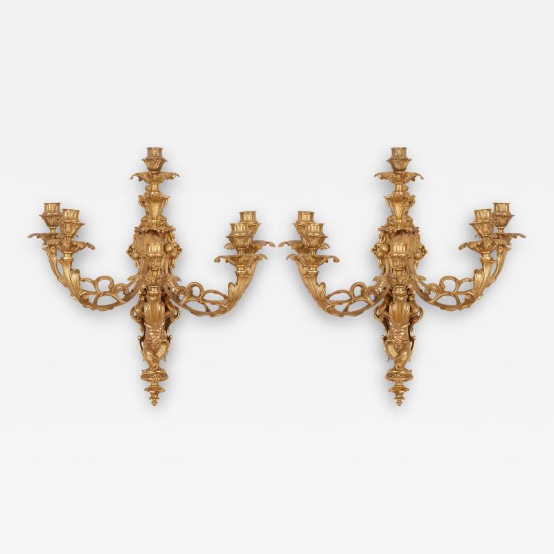 Two French Rococo style gilt bronze six light sconces