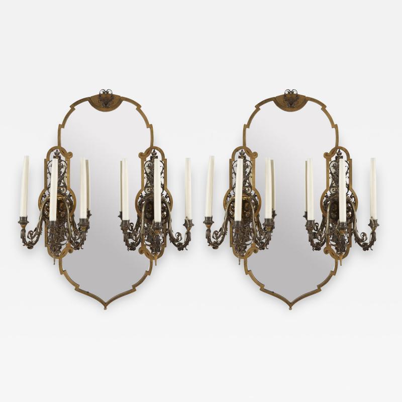 Two Rococo style gilt and silvered metal girandoles