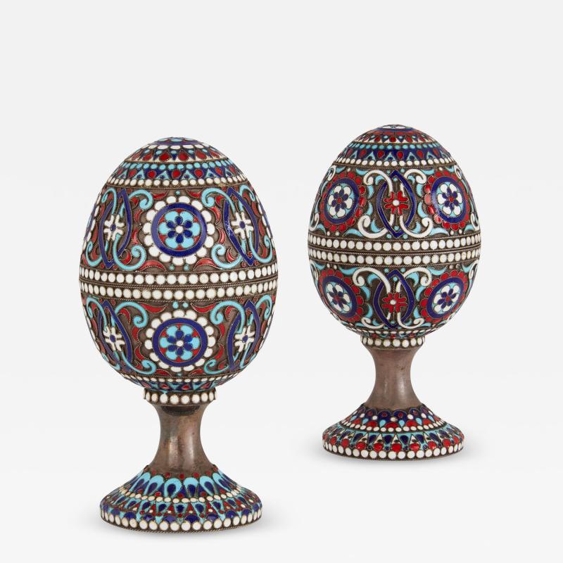 Two Russian silver gilt and cloisonn enamel Easter eggs on stands