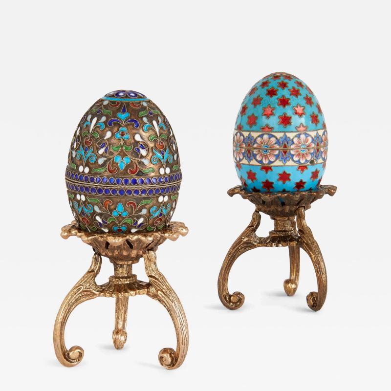 Two Russian silver gilt and cloisonn enamel eggs on stands