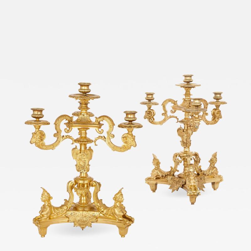 Two antique French gilt bronze four light girandoles