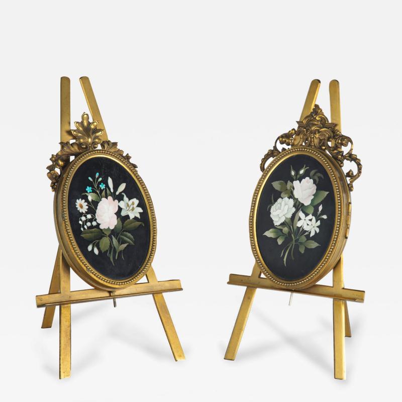 Two very similar pietra dura and ormolu photograph frames on easels