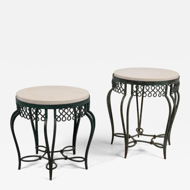 Two wrought iron side tables with replacement stone tops