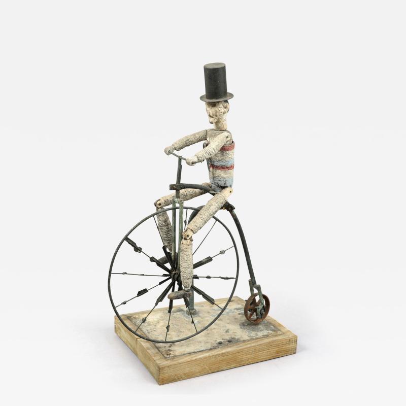 UNCLE SAM ON A HIGH WHEEL BICYCLE WHIRLIGIG