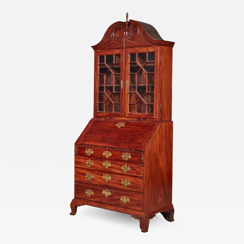 VERY FINE AND RARE CHIPPENDALE CARVED AND FIGURED MAHOGANY DESK AND BOOKCASE