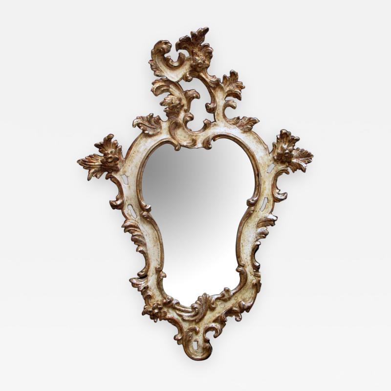 Venetian rococo revival ivory painted and parcel gilt cartouche shaped mirror