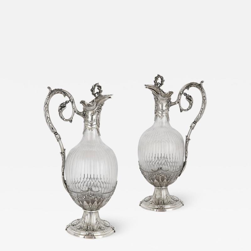 Victor Boivin Pair of Rococo style silver mounted crystal jugs by Boivin