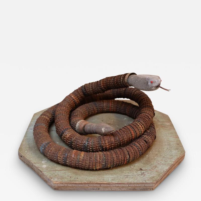 Vintage Folk Art Hand Carved Wood and Bottlecap Snake on Octagonal Base