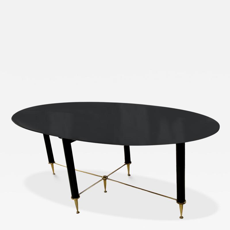 Vintage Italian Oval Ebonized Dining Table resting on a Bronze Base