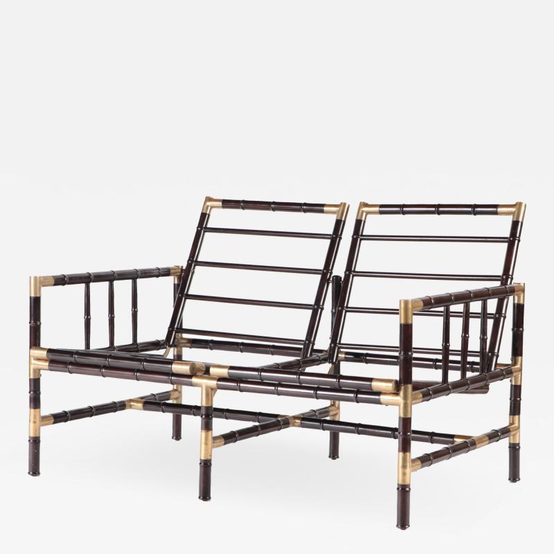 William Billy Haines A brass mounted faux bamboo adjustable settee In the manner of Billy Haines