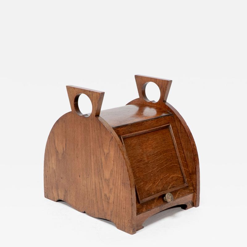 William James Neatby W J Neatby attri An Arts Crafts oak coal box with stylized carrying handles