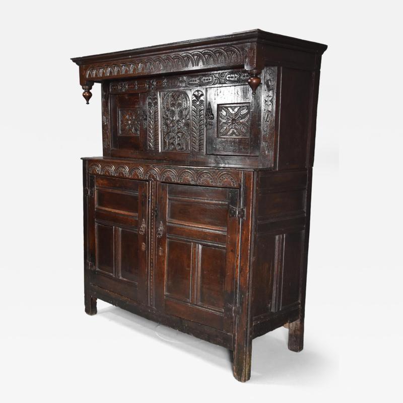 Wonderful mid 17thc carved oak press cupboard with superb patina