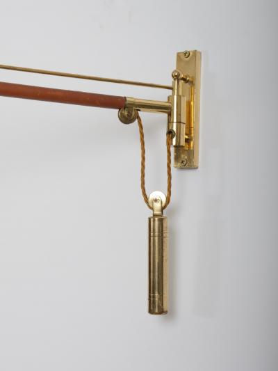 Arredoluce Swing arm wall light Brass and leather Italy c1950 Brass n
